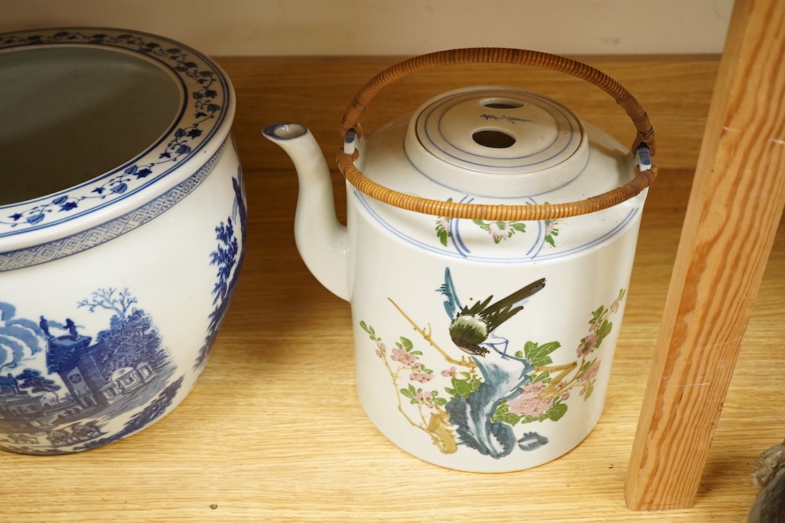 A pair of Chinese large scale teapots and a European blue and white planter, 22.5cm
